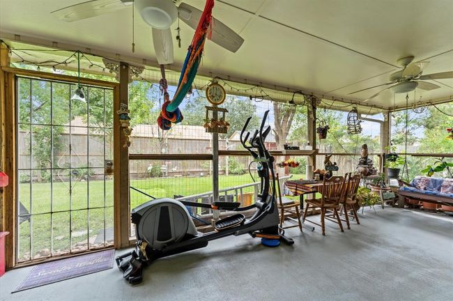 Step out into this relaxing Sunroom with views of your backyard. | Image 27
