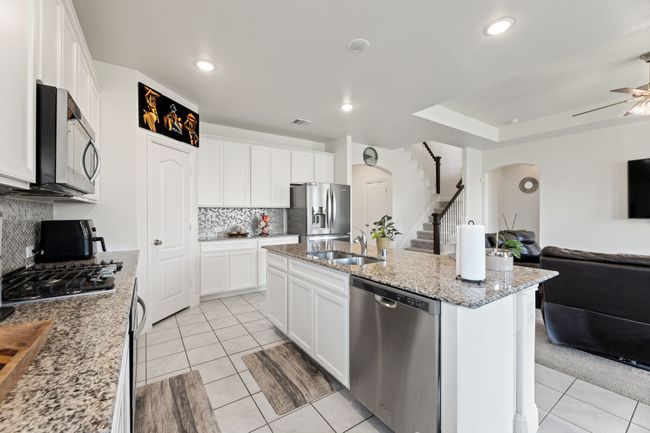 Kitchen featuring white cabinets and recessed lighting | Image 17