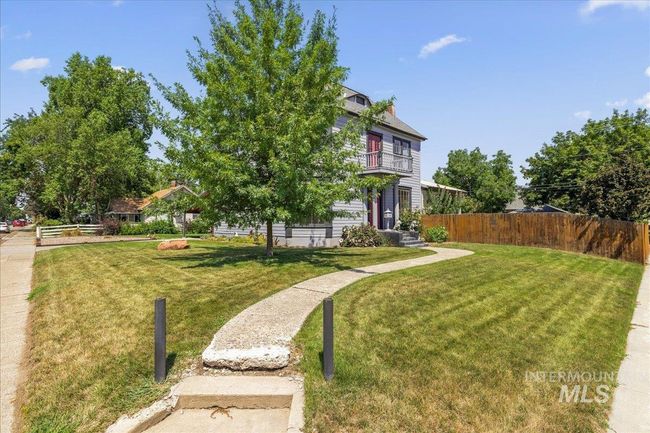 View of yard featuring a balcony | Image 49