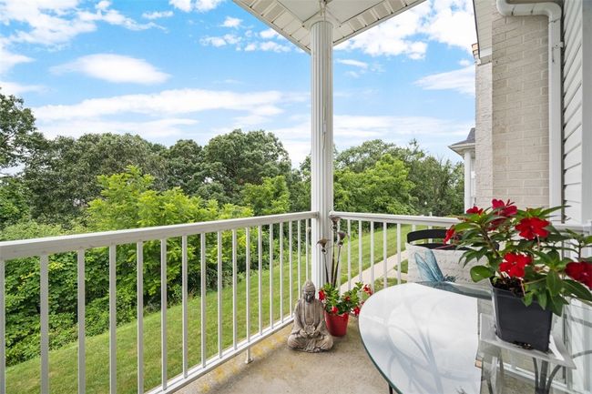Start or end your day here on this covered balcony located right off of the owners suite. Amazing! | Image 22