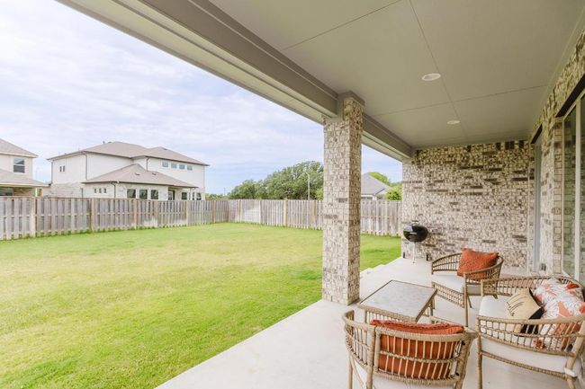 Covered backyard patio | Image 34