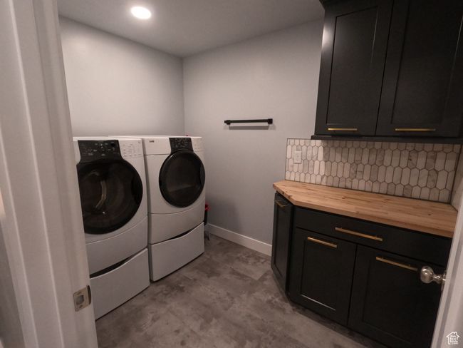 Laundry area with cabinet space, independent washer and dryer, and recessed lighting | Image 24