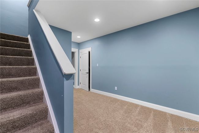 Stairs with carpet flooring and recessed lighting | Image 35