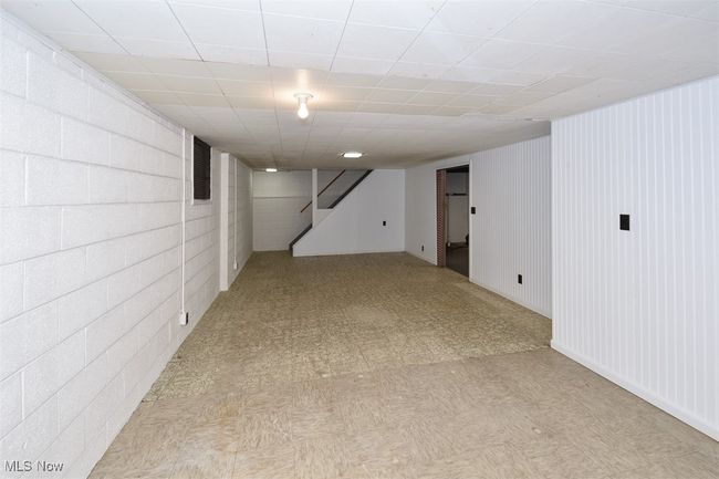 Finished basement featuring light floors and stairway | Image 45