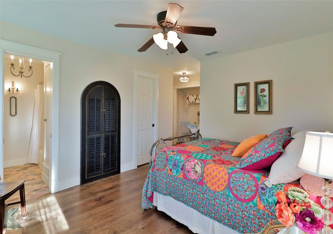 Bedroom with wood floors and a ceiling fan | Image 22