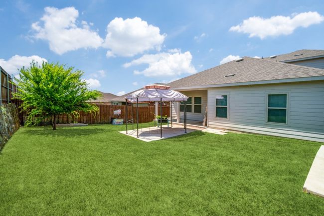 Fenced backyard featuring a patio area | Image 12