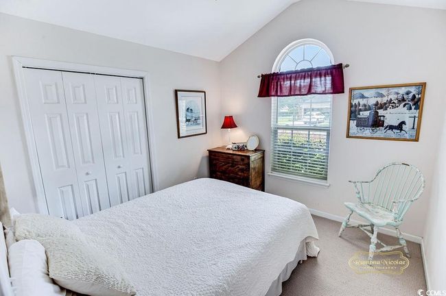 Bedroom with lofted ceiling, carpet floors, and a closet | Image 18