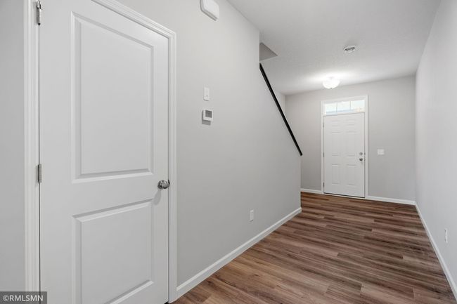 (Photo of previously finished home) Inviting foyer with ample space and a convenient coat closet. | Image 6