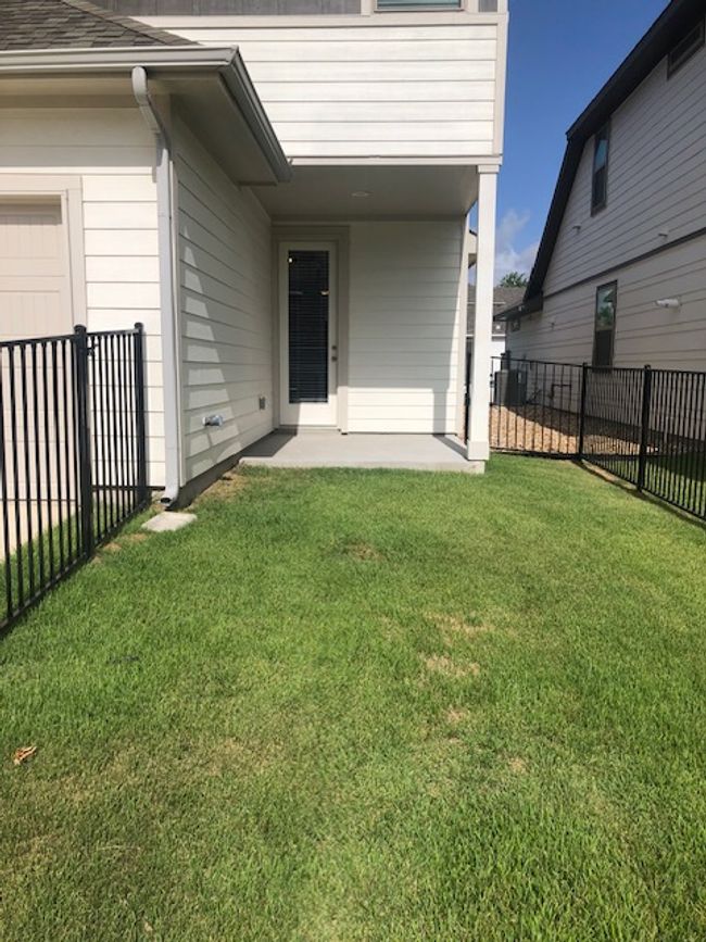 Back Entrance to property featuring a patio area and roof with shingles | Image 27