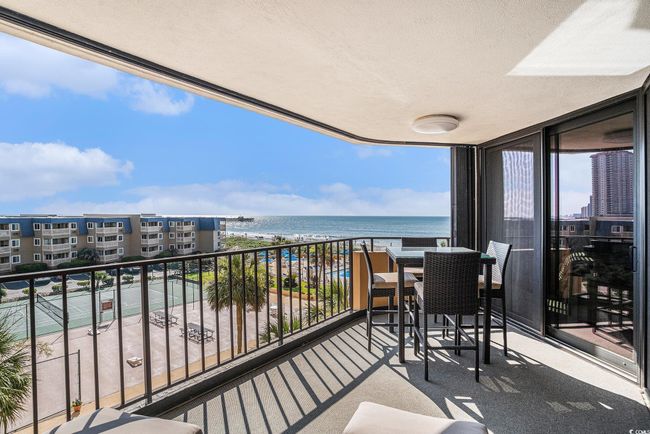 Balcony featuring view of water and beach | Image 29