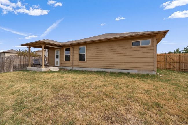 Back of house with a patio area and a fenced backyard-Note: Photo takenduring drought and zero watering days! | Image 26