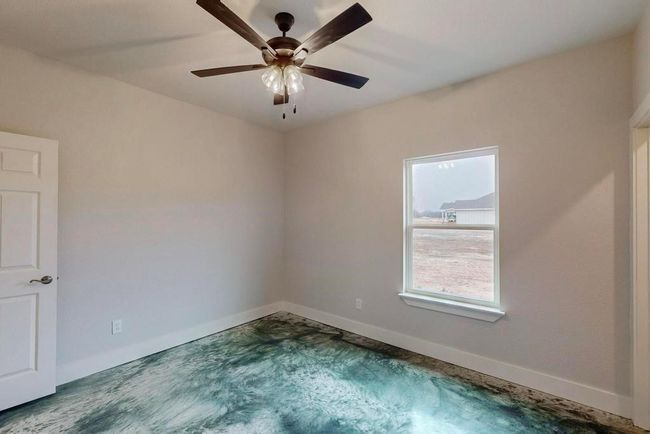 Unfurnished room with baseboards and ceiling fan | Image 14