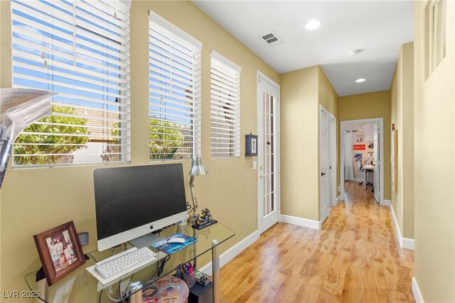 Corridor with light wood-style flooring, baseboards, and recessed lighting | Image 30