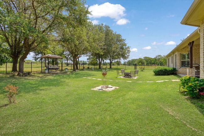 View of yard featuring a fire pit | Image 17