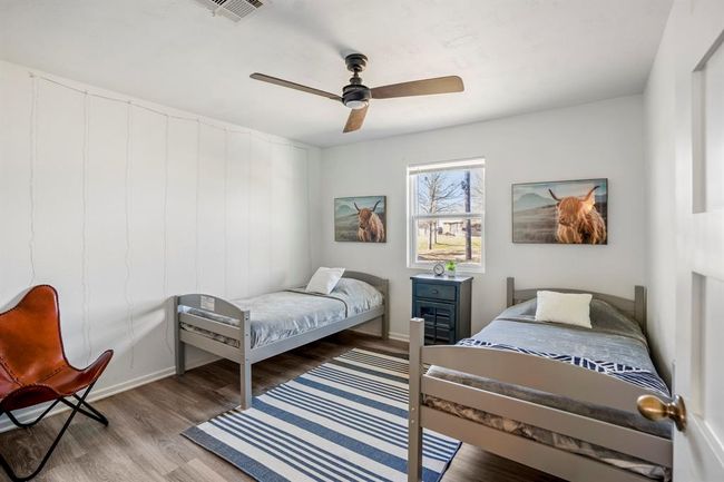 The third bedroom provides additional flexible space—well-suited for guests, family, or work-from-home needs. | Image 23