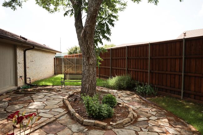 Fenced backyard featuring a patio | Image 31