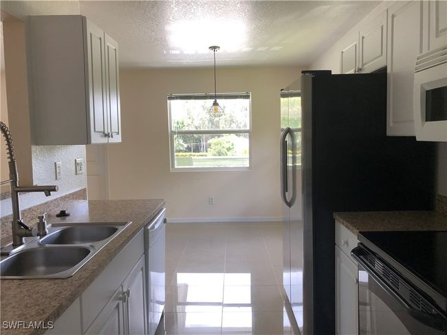 5615 Birdsong Ln, Home with 4 bedrooms, 2 bathrooms and null parking in BOKEELIA FL | Image 8