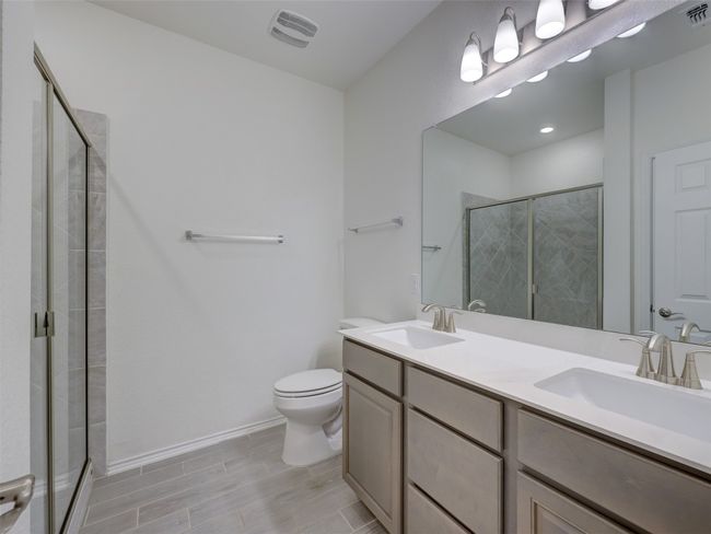 Full bath with 2 sinks and tiled, walk in shower | Image 31