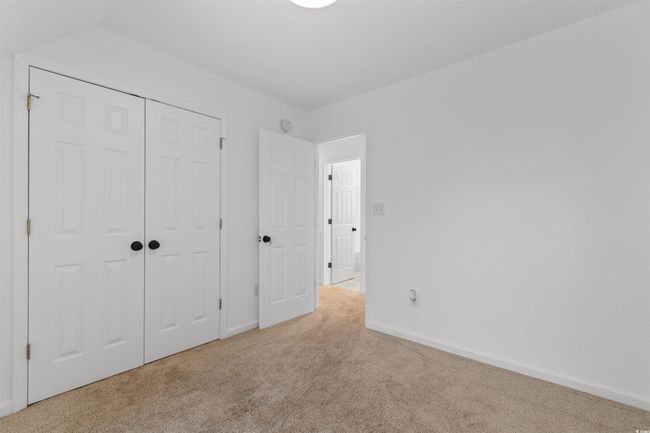 Unfurnished room with carpet, baseboards, and a ceiling fan | Image 19