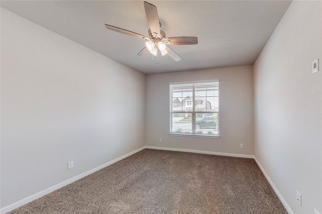 Empty room featuring carpet floors, ceiling fan, and baseboards | Image 33