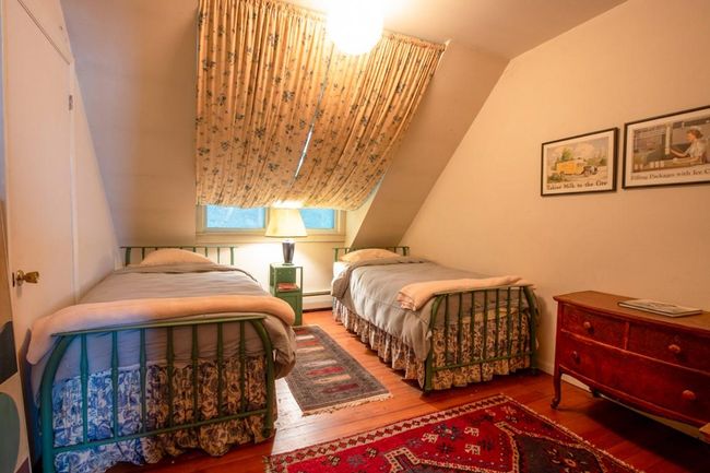 Bedroom featuring vaulted ceiling and hardwood / wood-style flooring | Image 12
