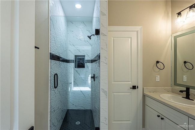 Full bathroom with a stall shower and vanity | Image 10