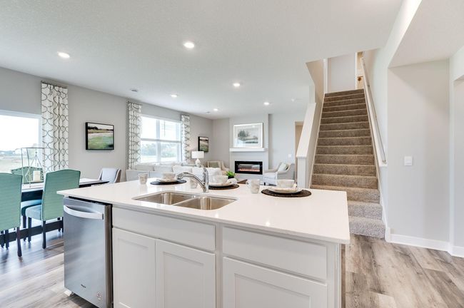 This large quartz kitchen island gives you ample space for all your food prepping needs. Previously built model home, finishes, selections, and colors to vary from future built home. | Image 8
