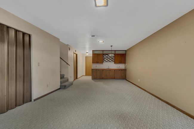 Huge Finished Lower Level Family Room with wet bar area and electric fireplace | Image 23