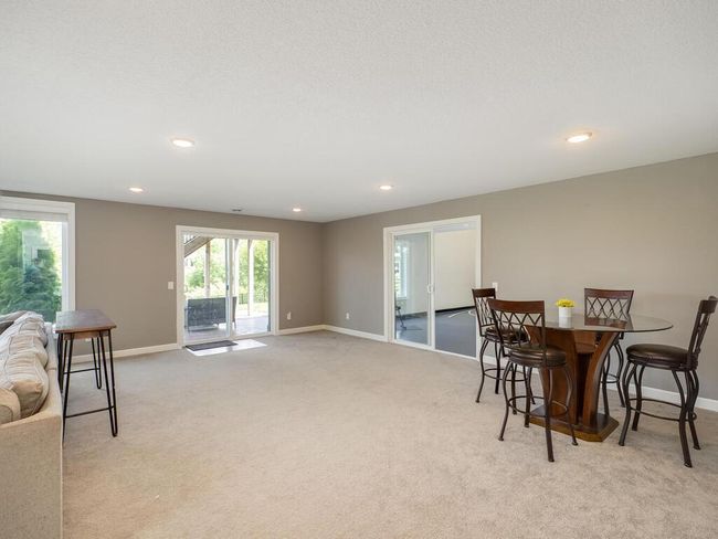 The walkout lower level leads to a patio in the fully fenced back yard. | Image 24
