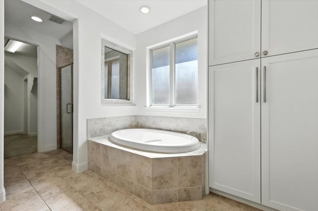 Full bath featuring a bath, a shower stall, and recessed lighting | Image 18