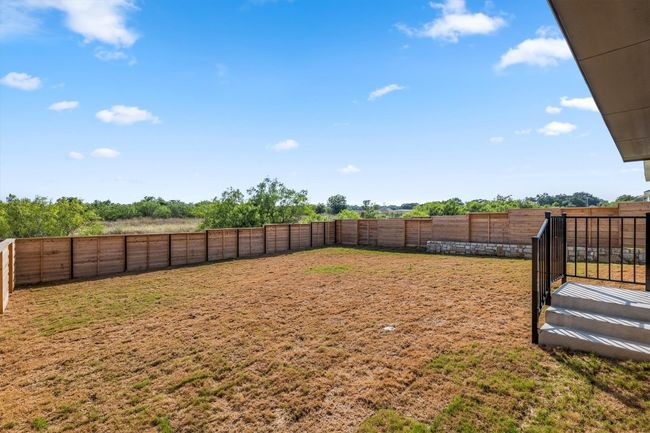 View of fenced backyard | Image 29