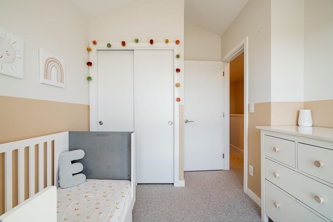 Bedroom featuring a closet, lofted ceiling, and light carpet | Image 22
