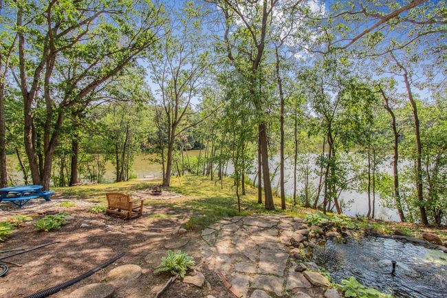 Here is a closer look at the pond and lovely flagstone landscaping. | Image 49