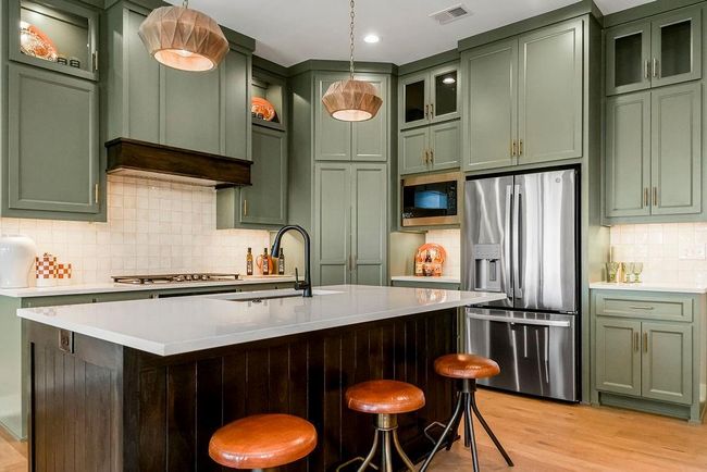 Kitchen with island and walk in pantry. Photos of previous model home. Not actual listing. Features and sizes may vary. Contact agent for details & showings! | Image 11