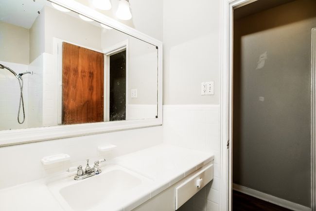Bathroom with vanity and a shower | Image 22