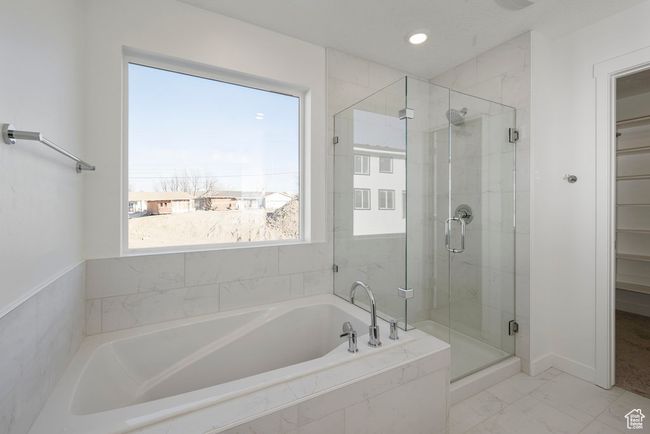 Serene and stylish, this bathroom retreat includes dual sinks for easy mornings, a luxurious soaking tub for quiet nights, and a spacious shower for everyday ease. | Image 21