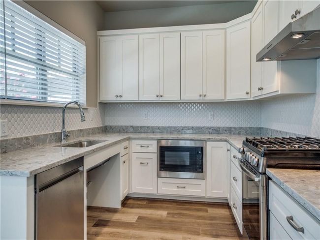View of kitchen sink with wheel chair access. | Image 5