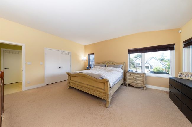 Bedroom featuring baseboards and light colored carpet | Image 25