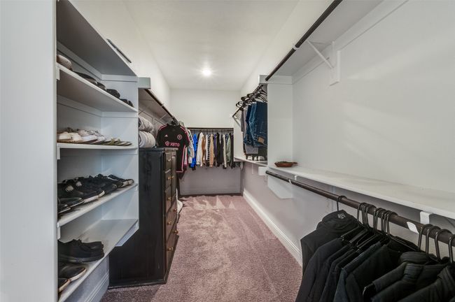 Walk in closet with carpet floors | Image 31