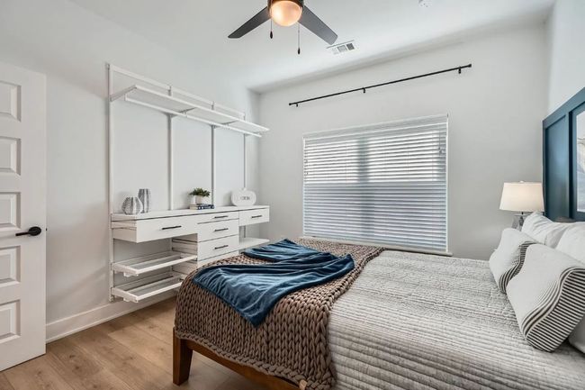 2nd Bedroom with light wood finished floors and ceiling fan | Image 21