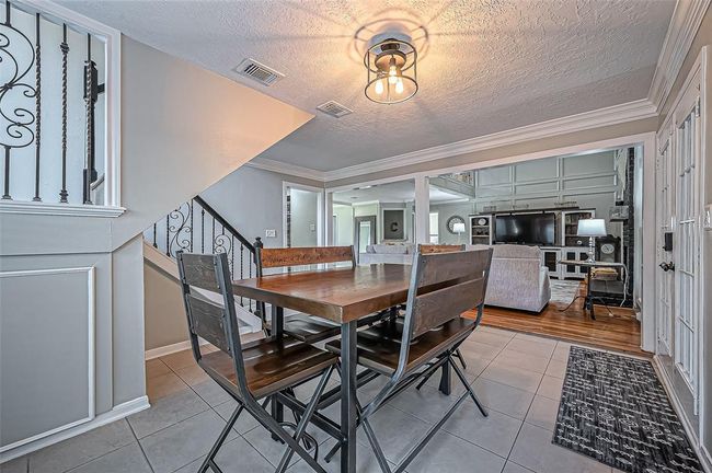 Charming breakfast nook by the patio doors, offering easy access to your private backyard retreat. | Image 9