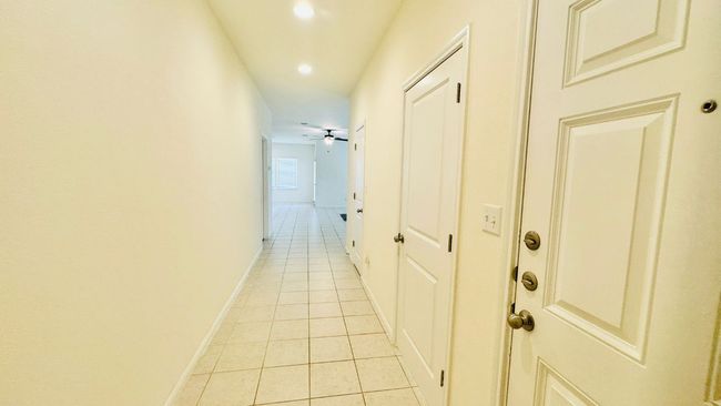 Hall featuring light tile patterned floors and recessed lighting | Image 7
