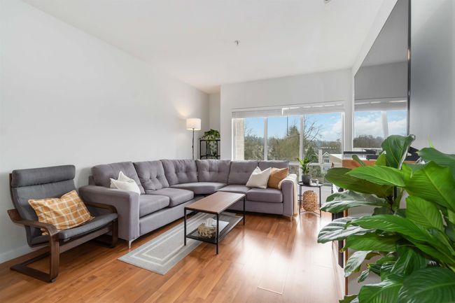 Living area with light wood-type flooring | Image 7