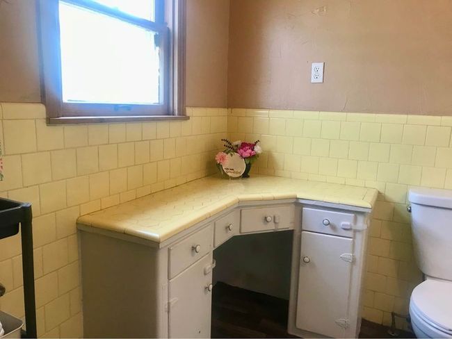 Bathroom featuring toilet and tile walls | Image 14