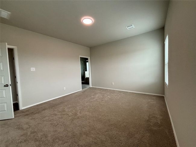 Carpeted spare room with baseboards | Image 23