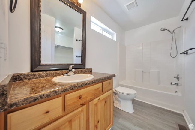 Primary bathroom with LVP flooring | Image 16