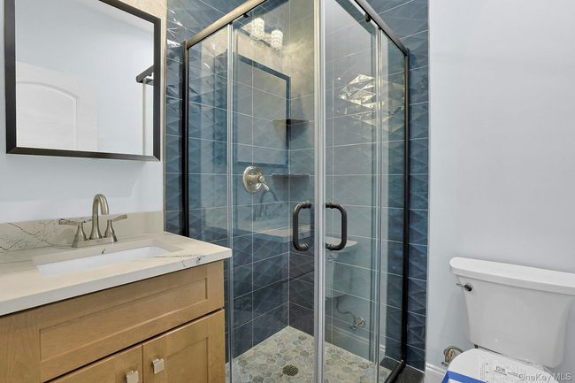Bathroom featuring vanity and a stall shower | Image 20