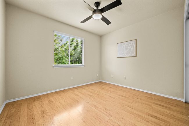 Unfurnished room featuring wood finished floors and ceiling fan | Image 28