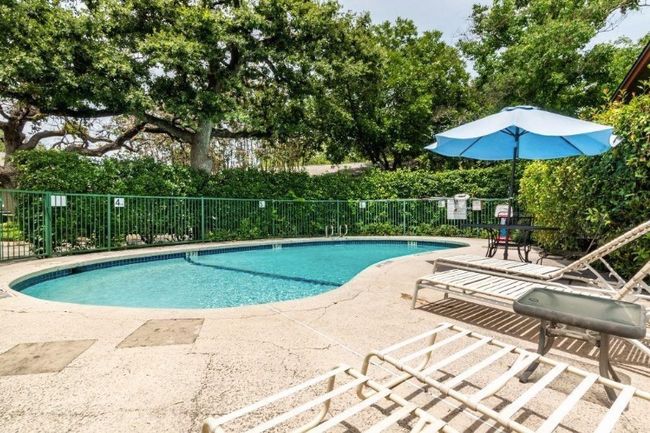 Community pool with a patio area | Image 22