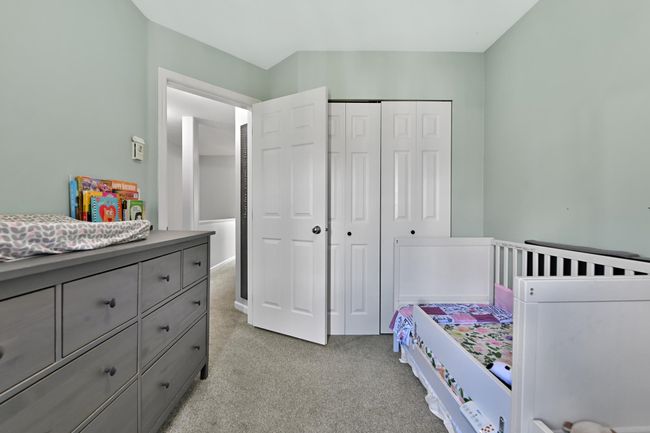 Bedroom featuring a closet and light colored carpet | Image 32